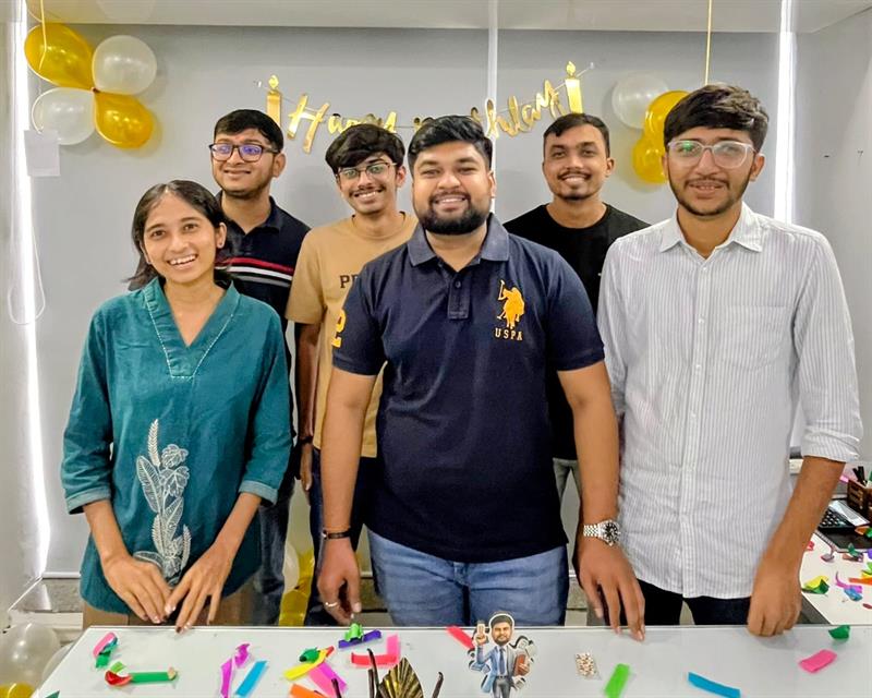 Office birthday celebration with balloons